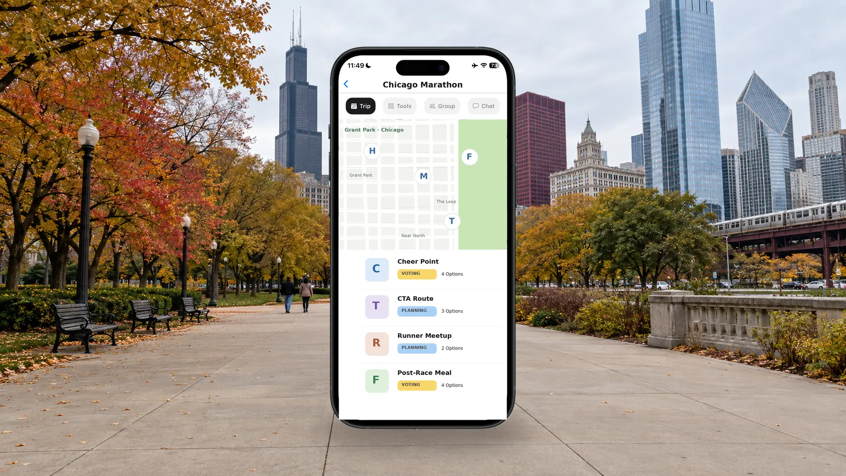 FlowTrip Chicago Marathon spectator plan on a phone beside an autumn path in Grant Park and the Chicago skyline