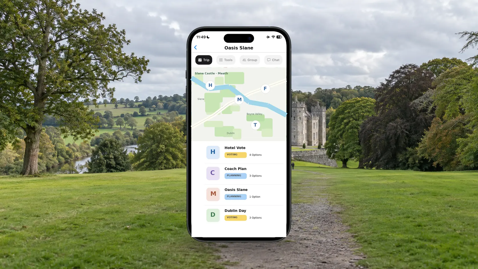 FlowTrip Oasis Slane trip plan on a phone in the green grounds of Slane Castle in County Meath